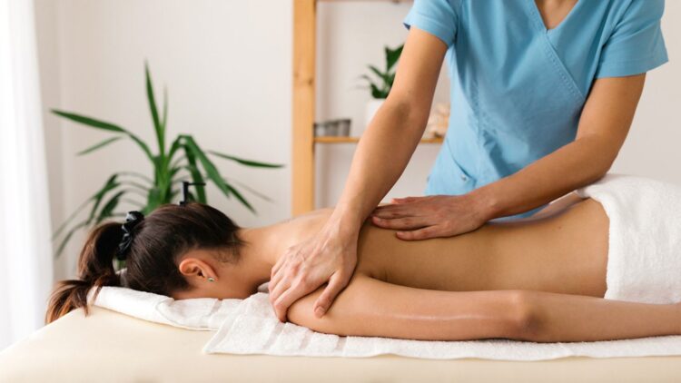 A woman getting a back massage